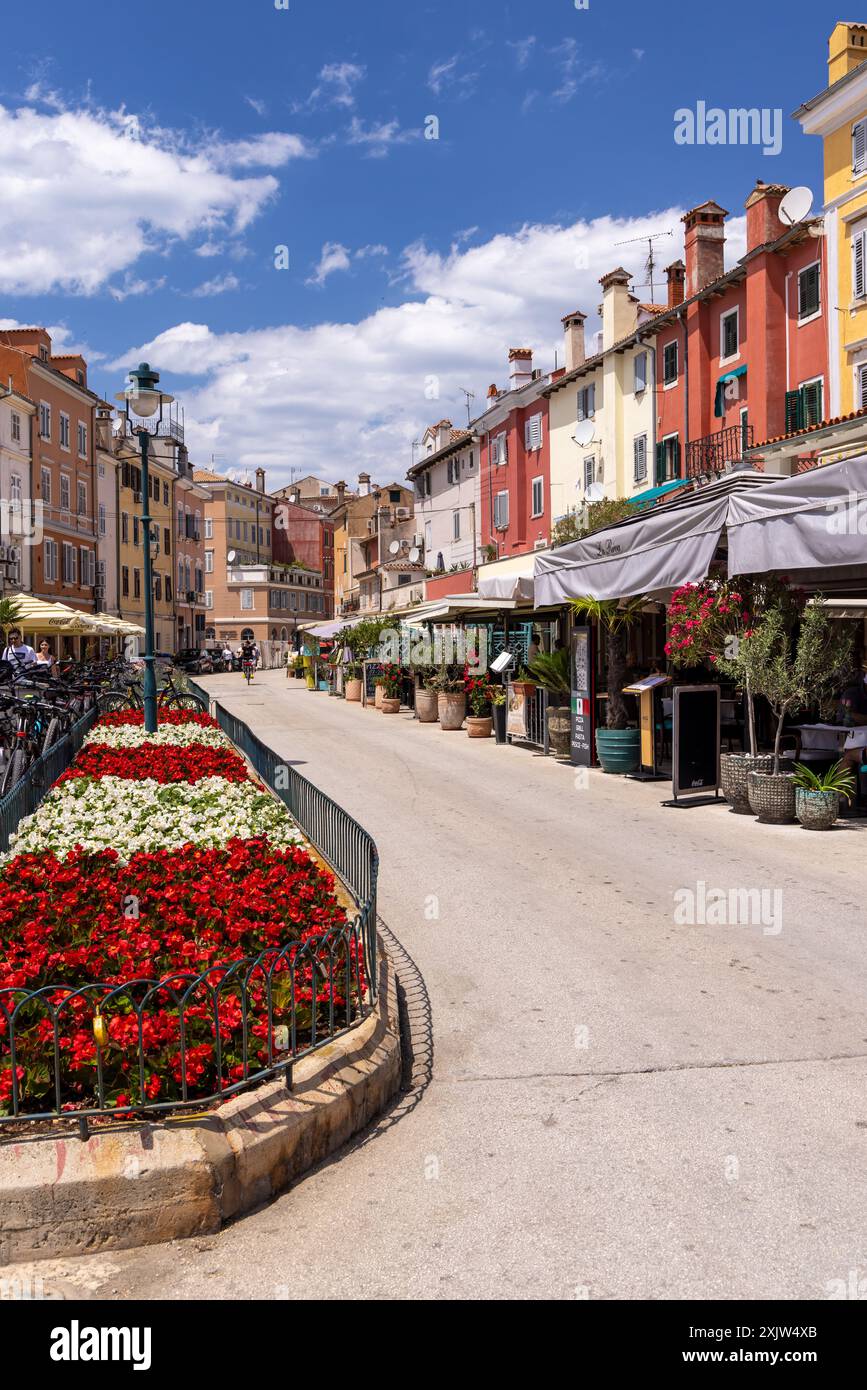 Bright colourful buildings, restaurants and bars in a street in the old town of Rovinj, Croatia, Europe Stock Photo