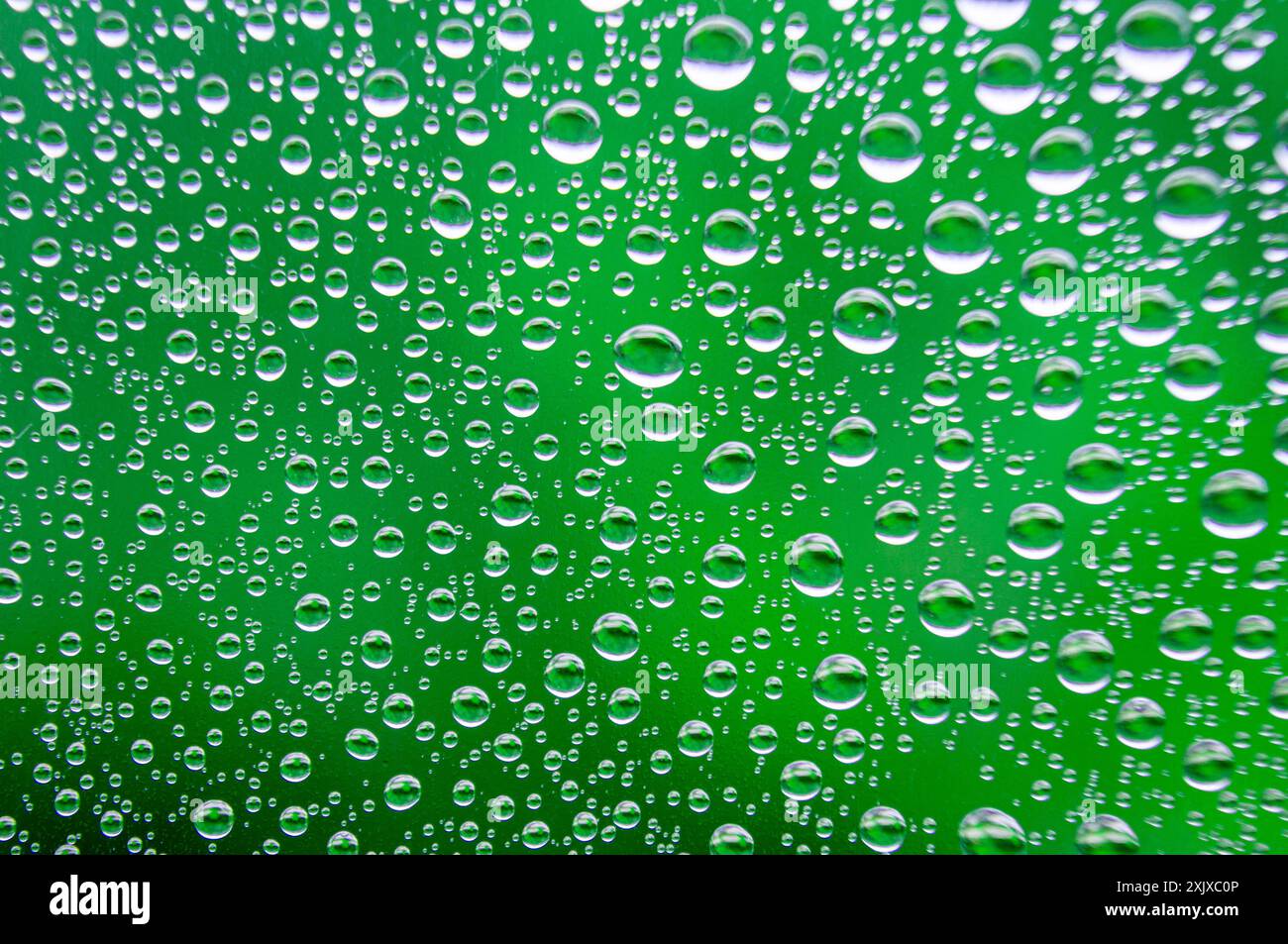 Clear water droplets with blurred nature background. Image suitable for wallpaper or any design background. Stock Photo