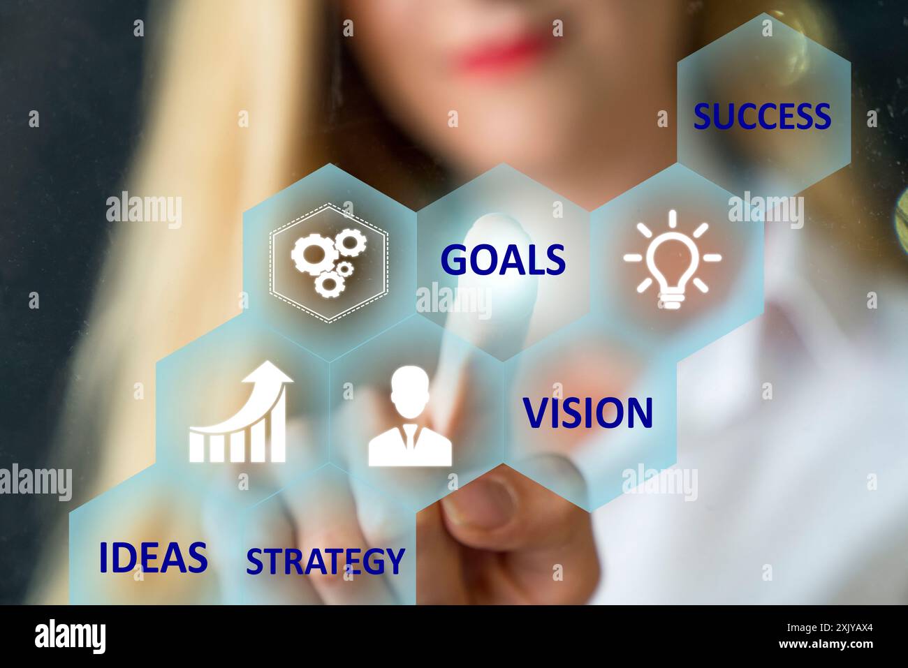 Person touching an hexagonal button on a digital interface Stock Photo