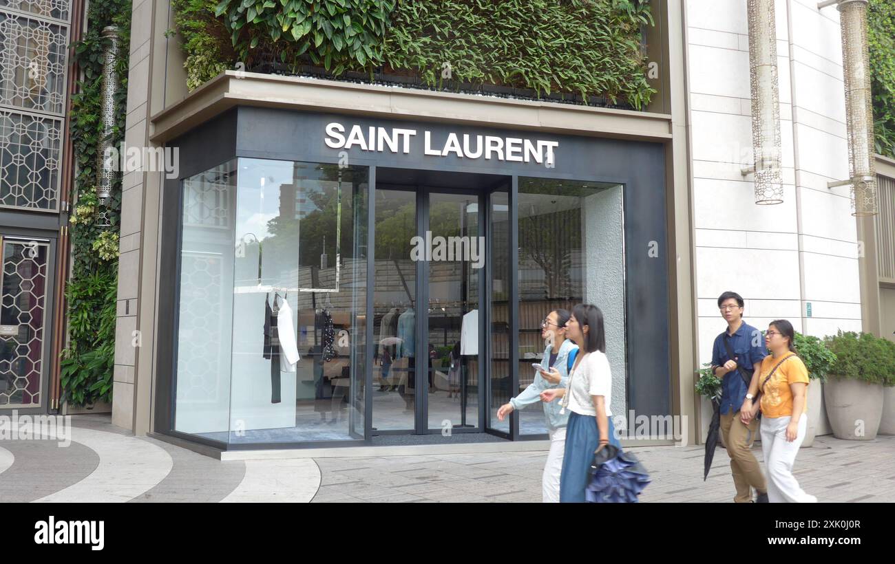 French Luxury Fashion House Crossword 2026.Pedestrians walk past the French luxury fashion house Saint Laurent ...