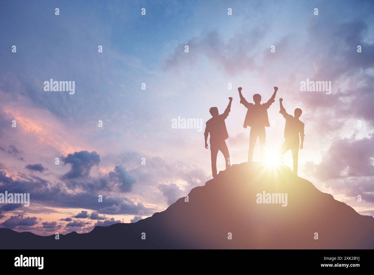 Silhouette of a team celebrating a victory against sunset background ...