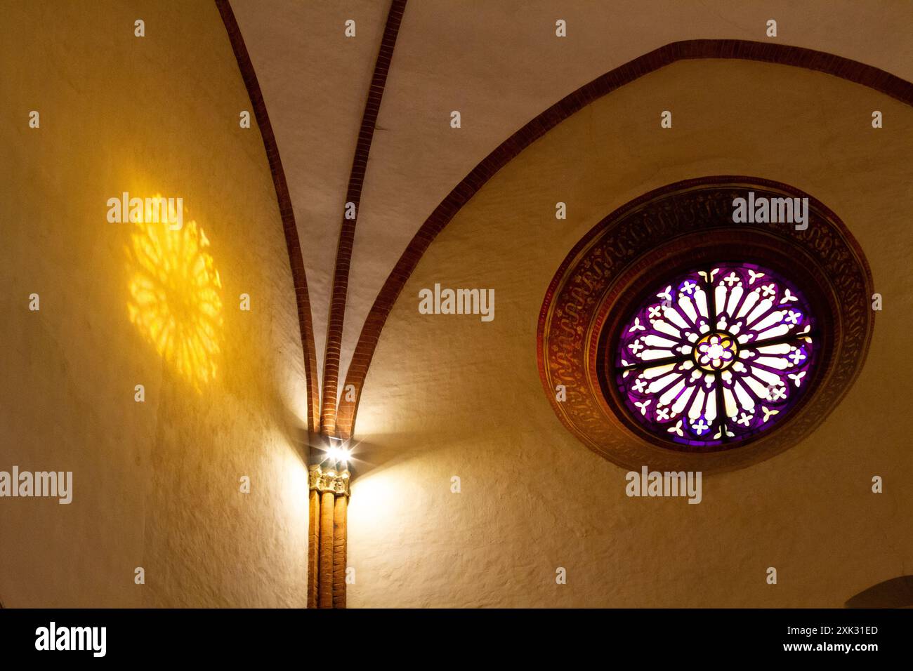 A stained-glass window. Santa Maria del Carmine [Our Lady of Carmel Church] in Pavia, Italy. Stock Photo