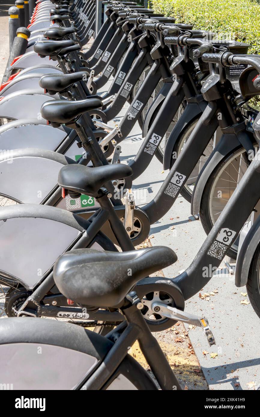 Rideshare bikes on rack Stock Photo - Alamy