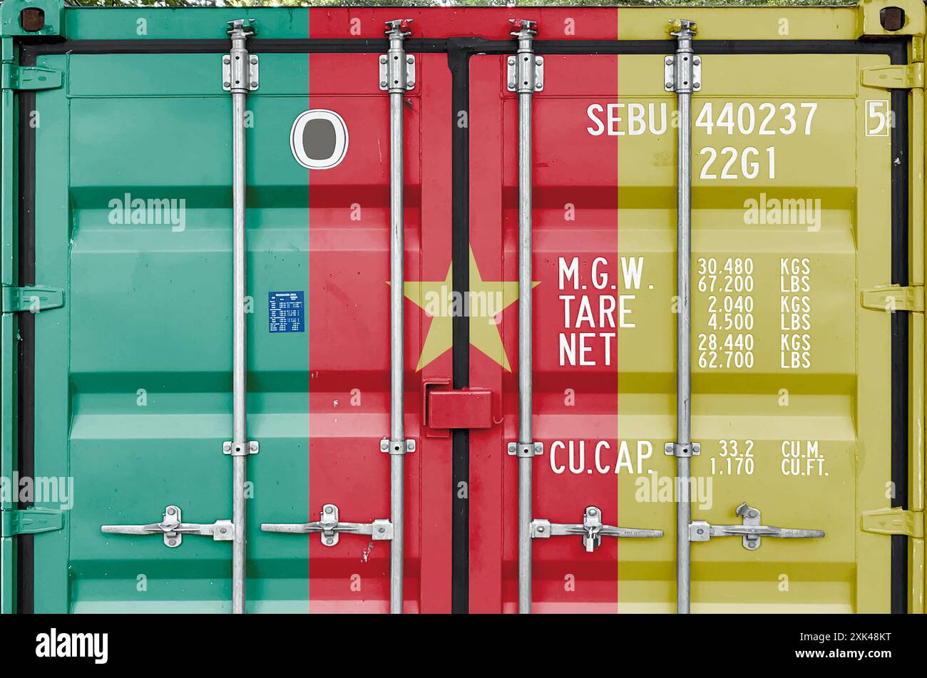 Cameroon flag depicted on metal doors of shipping cargo container outdoors in docks area close up Stock Photo