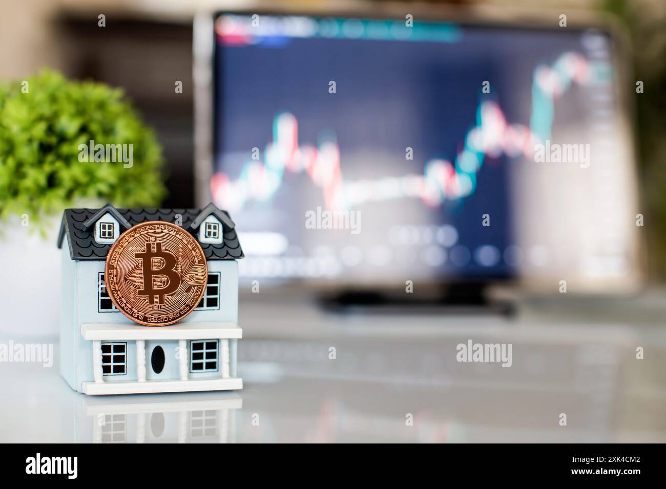 Buying real estate for cryptocurrency. Housing and bitcoins. Coins and  house keys. Small wooden house and bitcoin coin Stock Photo - Alamy