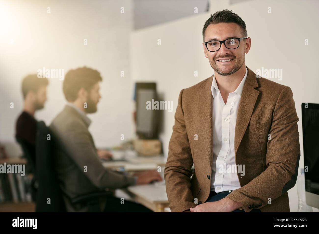Creative, man and portrait with smile in office for work or career in ...