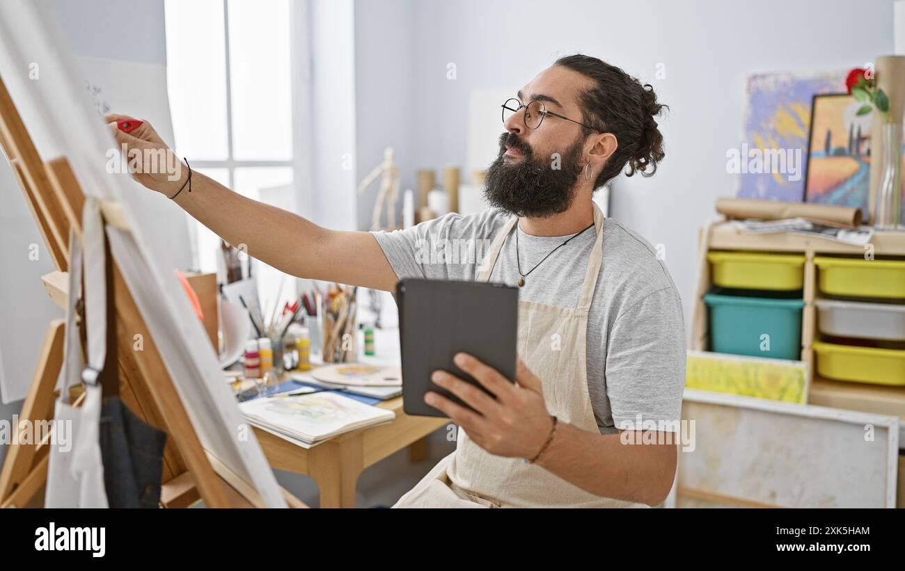 Bearded man paints on canvas hi-res stock photography and images - Alamy