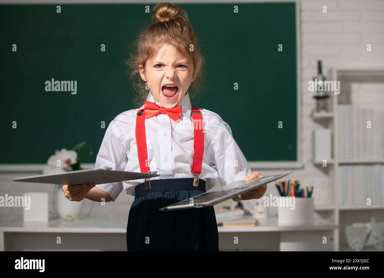 Angry child in class hi-res stock photography and images - Alamy