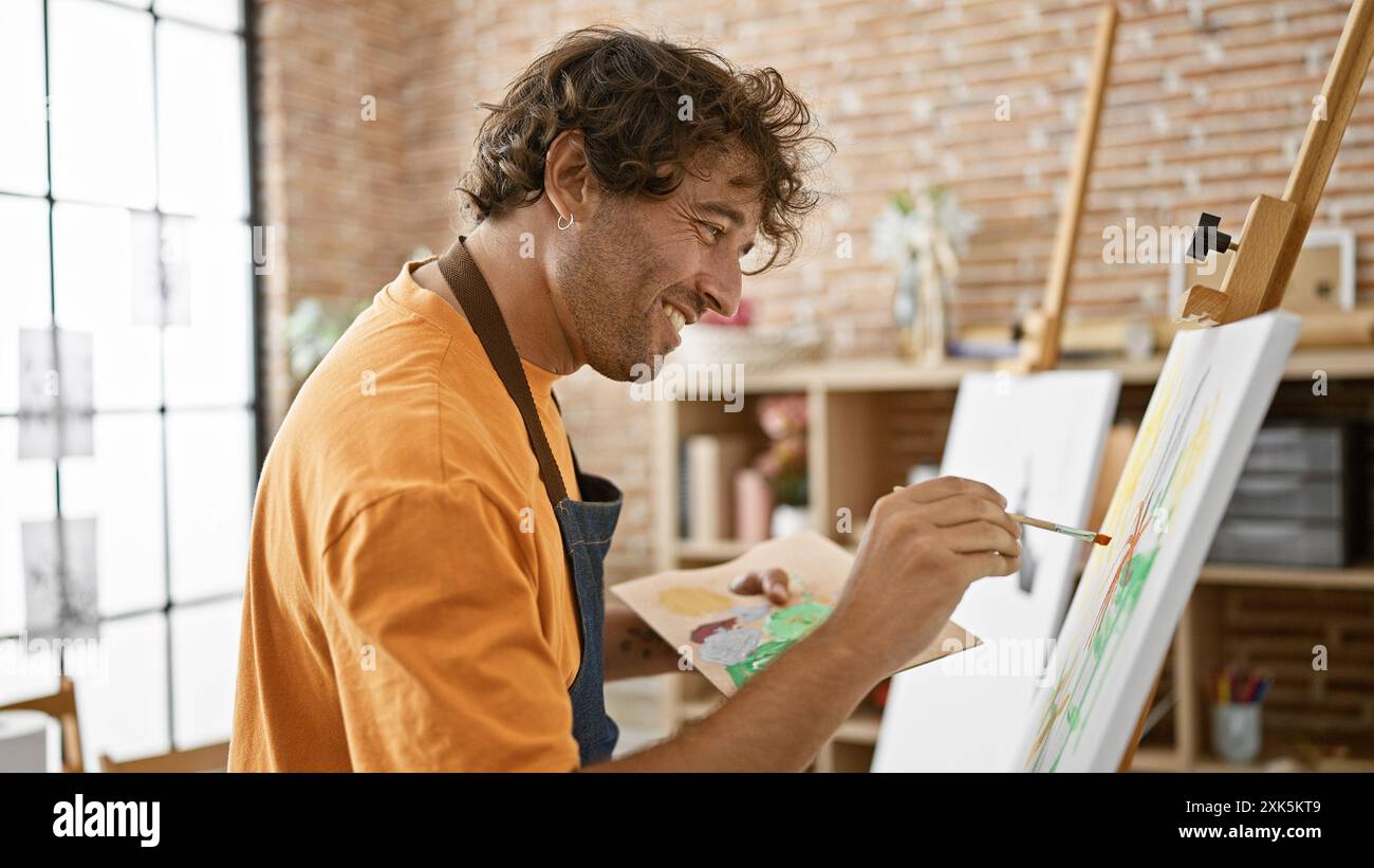 Focused young man paints hi-res stock photography and images - Alamy