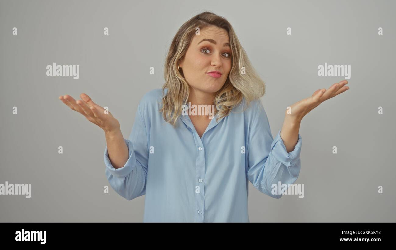 Puzzled young blonde woman in hi-res stock photography and images - Alamy