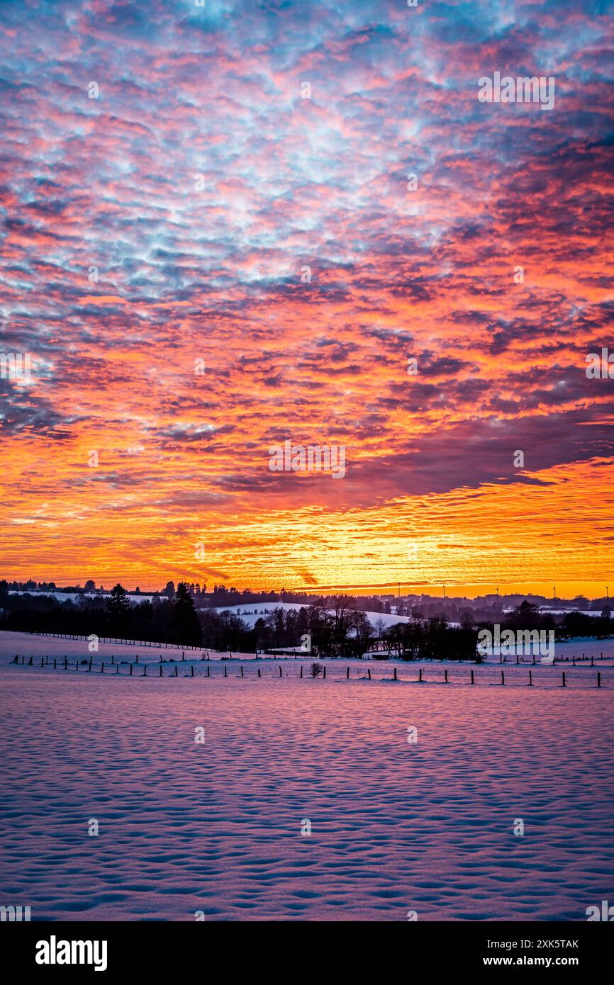 Sunset over fields in winter Stock Photo