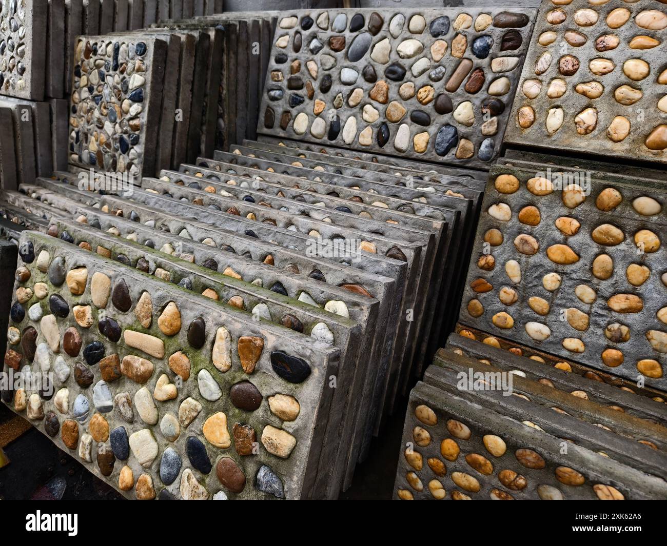 Cement With Rocks A pile of concrete tiles filled with rocks on top Stock Photo - Alamy