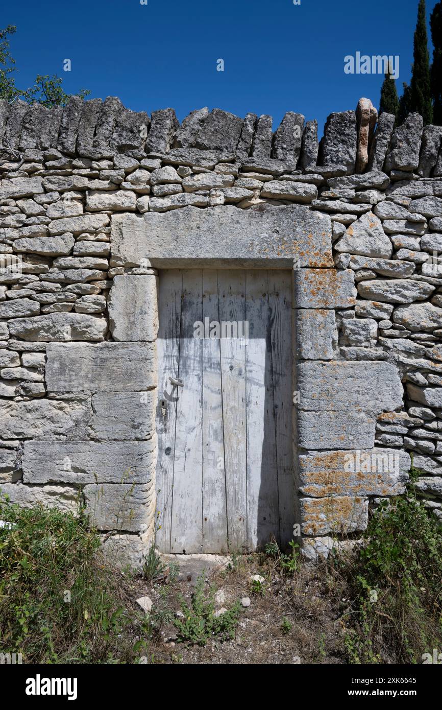 A doorway leading to a private garden in Gordes, Vaucluse,Provence, France. Stock Photo