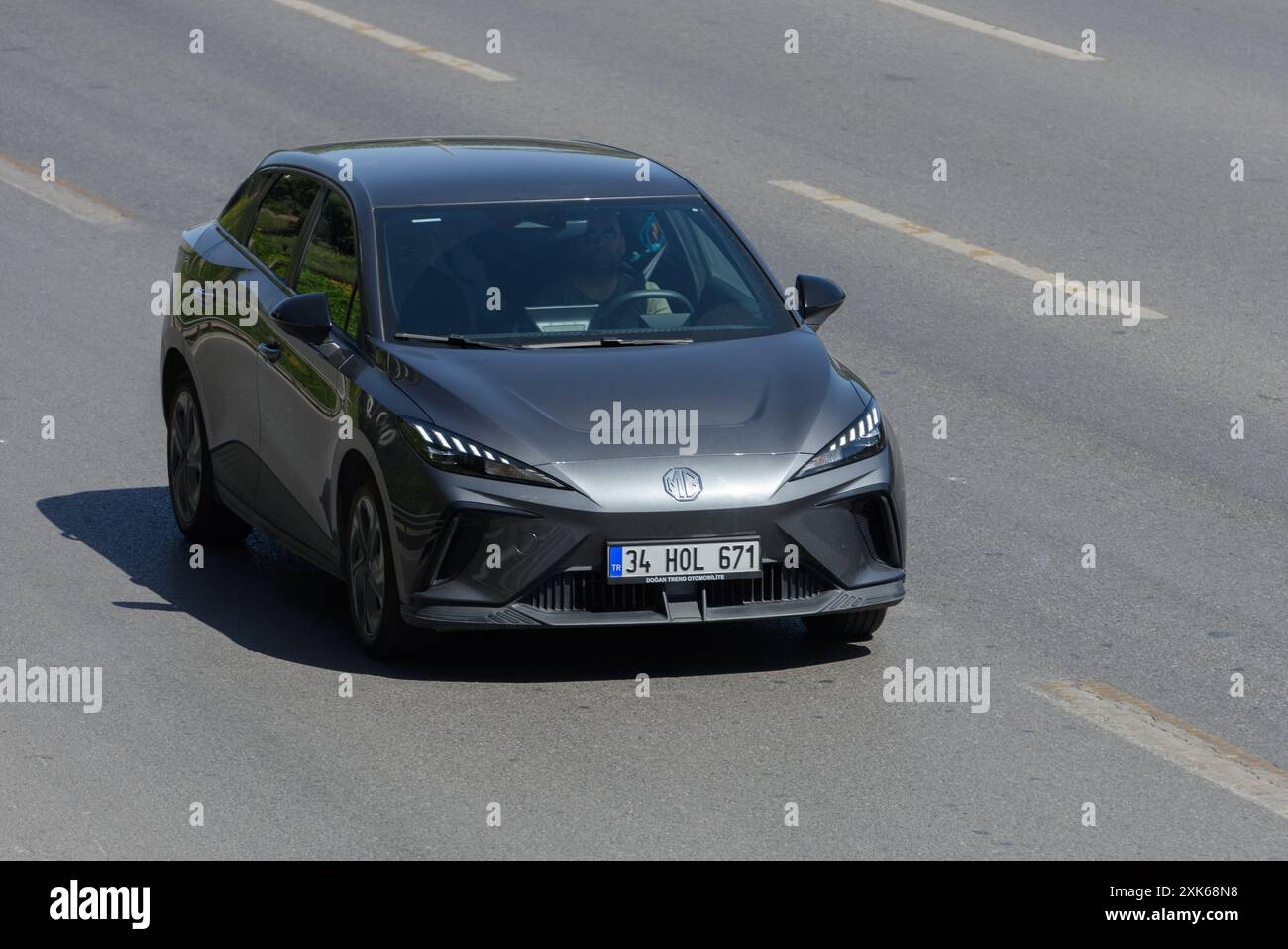 ISTANBUL, TURKEY -JULY 7, 2024: Morris Garage brand metallic gray sedan ...
