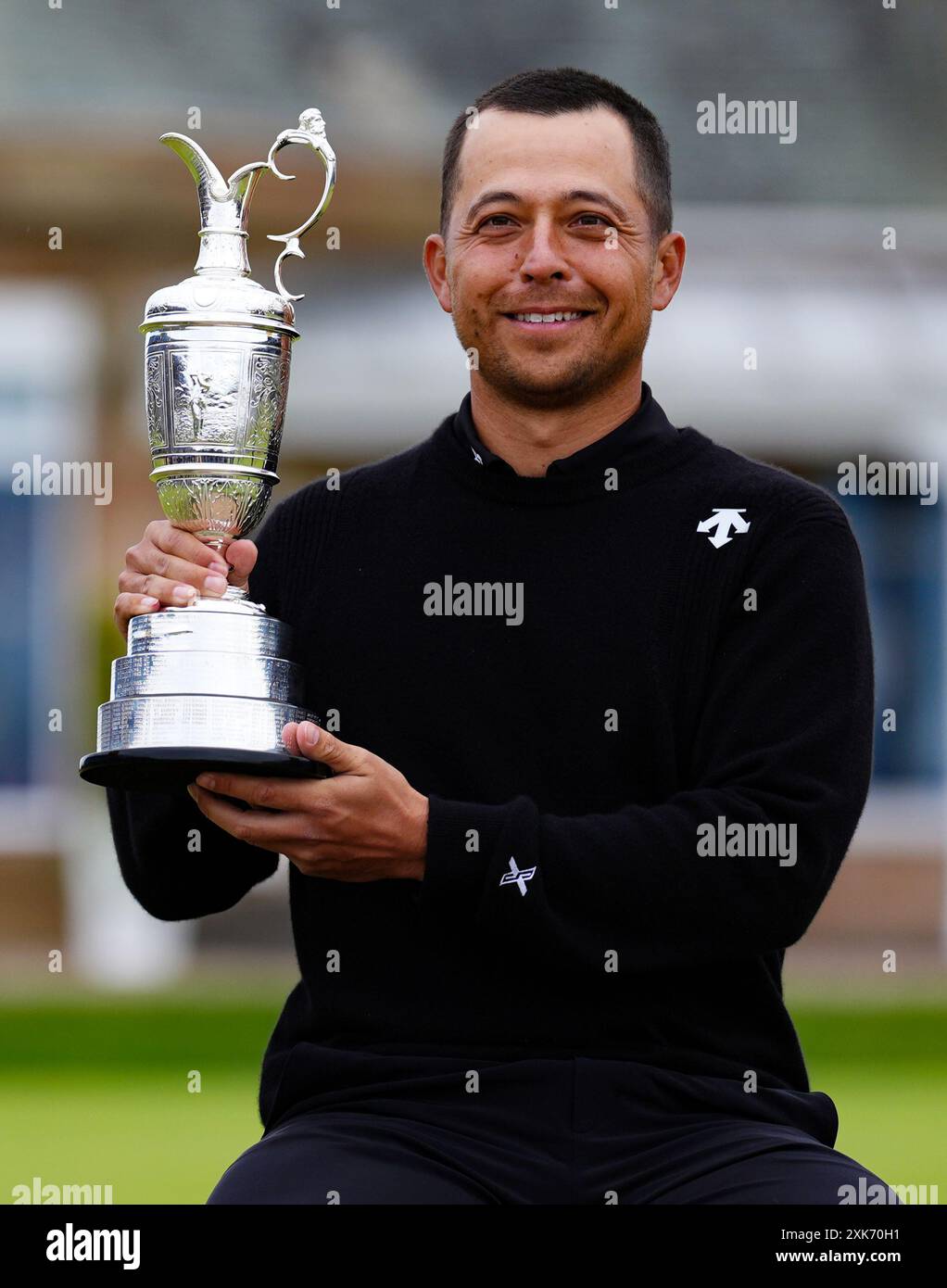 USA's Xander Schauffele celebrates with the Claret Jug after winning