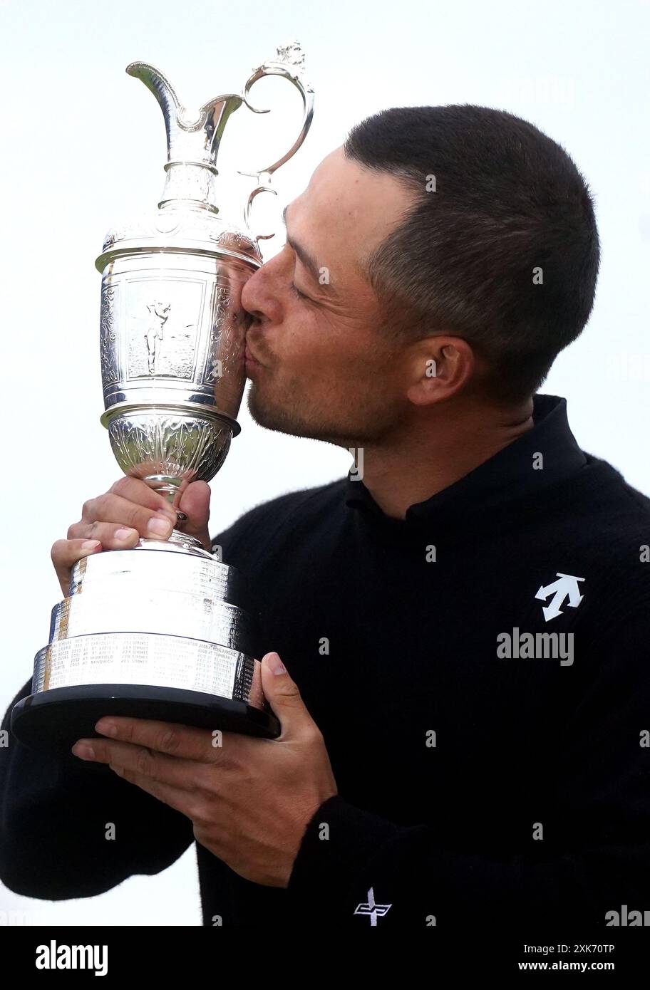 USA's Xander Schauffele celebrates with the Claret Jug after winning