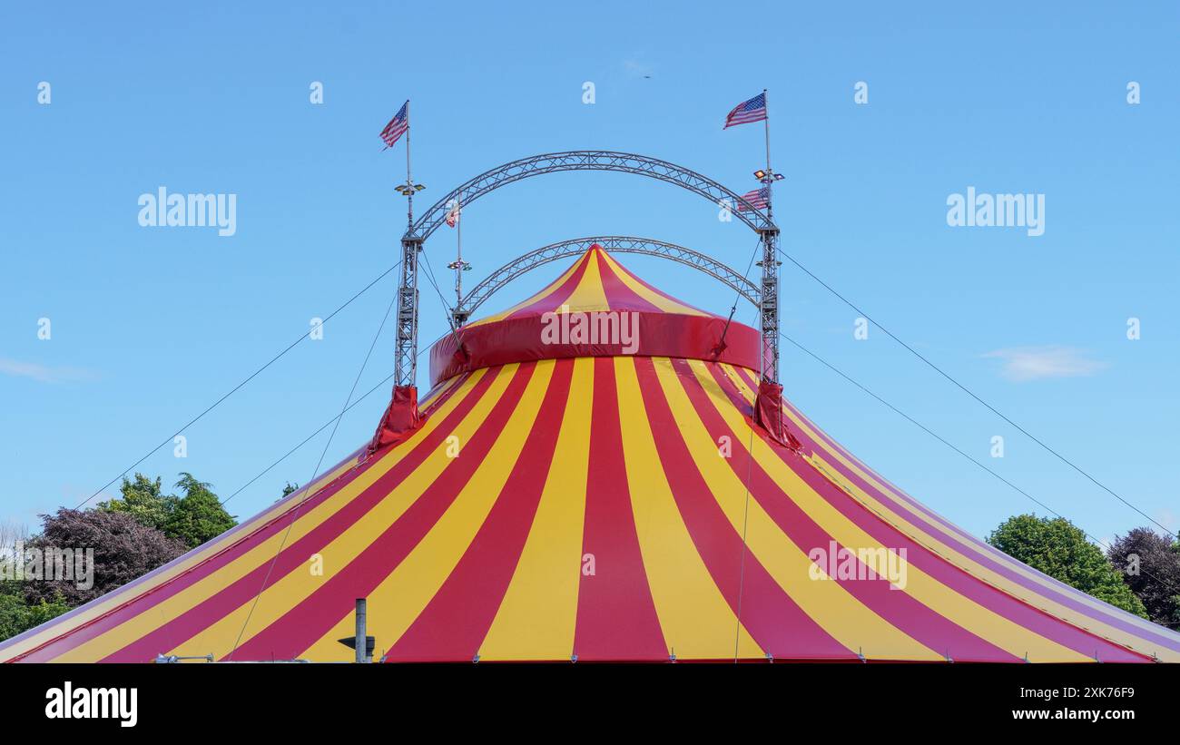 Bridgend, Wales - July 7 2024: A large, brightly coloured circus big ...