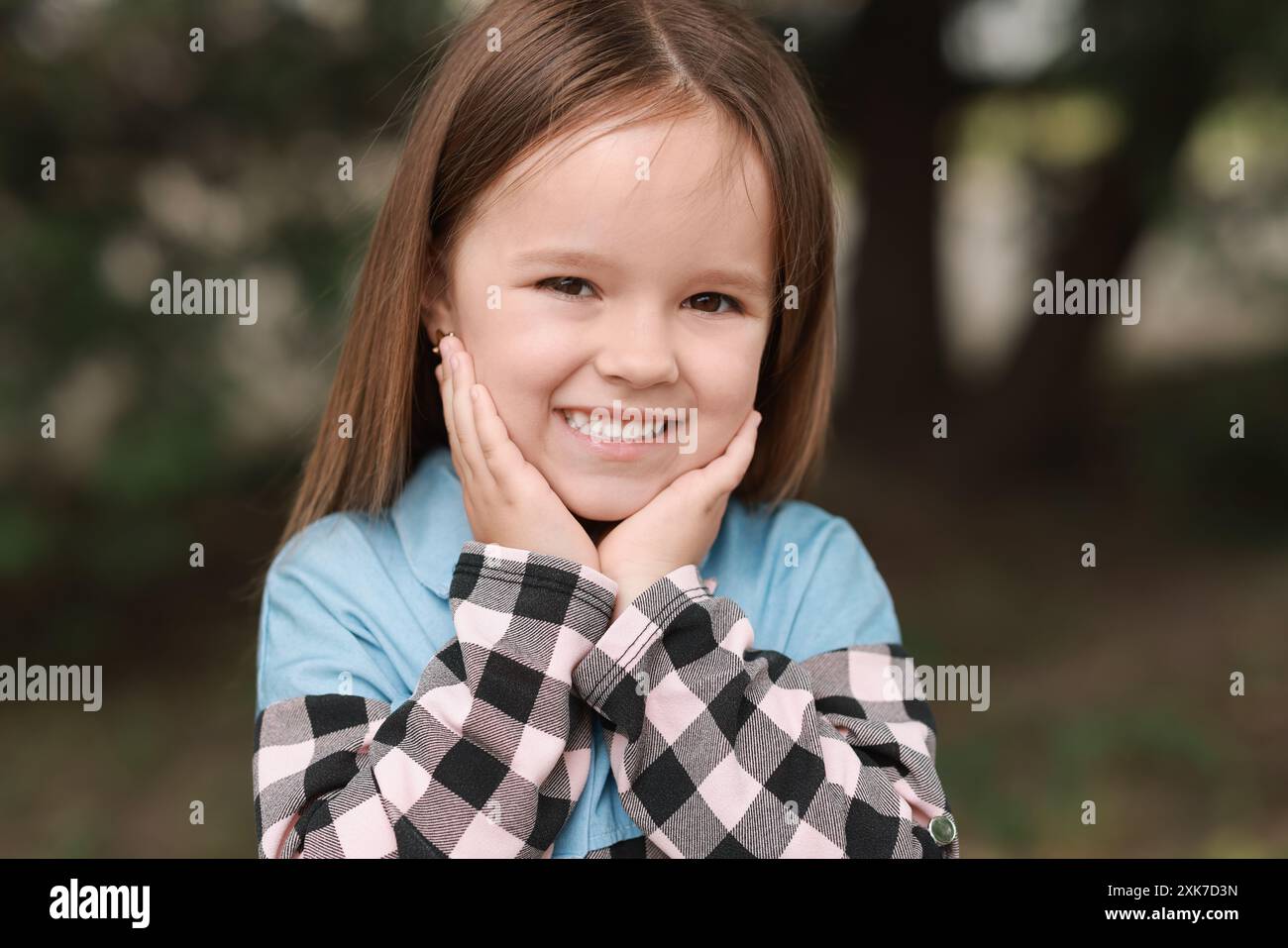 Portrait of happy little girl outdoors. Cute child Stock Photo - Alamy