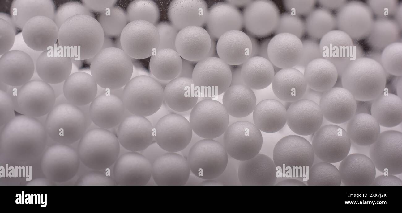White little polystyrene foam balls as background Stock Photo - Alamy