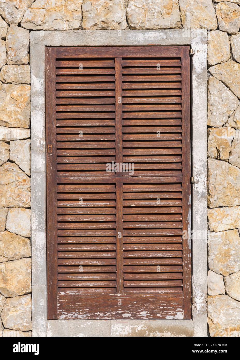 Wooden door in a stone wall Stock Photo - Alamy