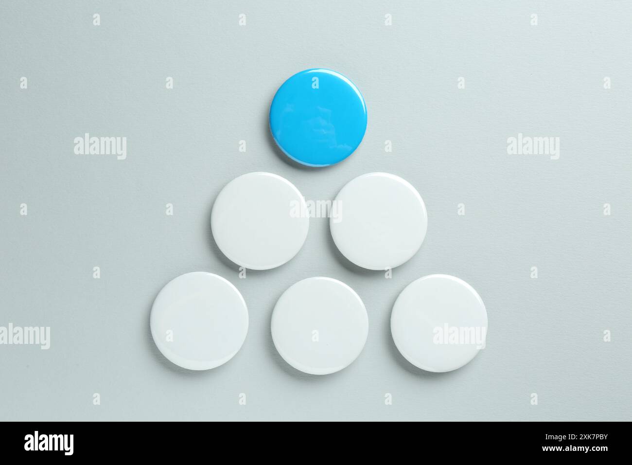 Blank button badges on light background, flat lay. Mockup for design Stock Photo