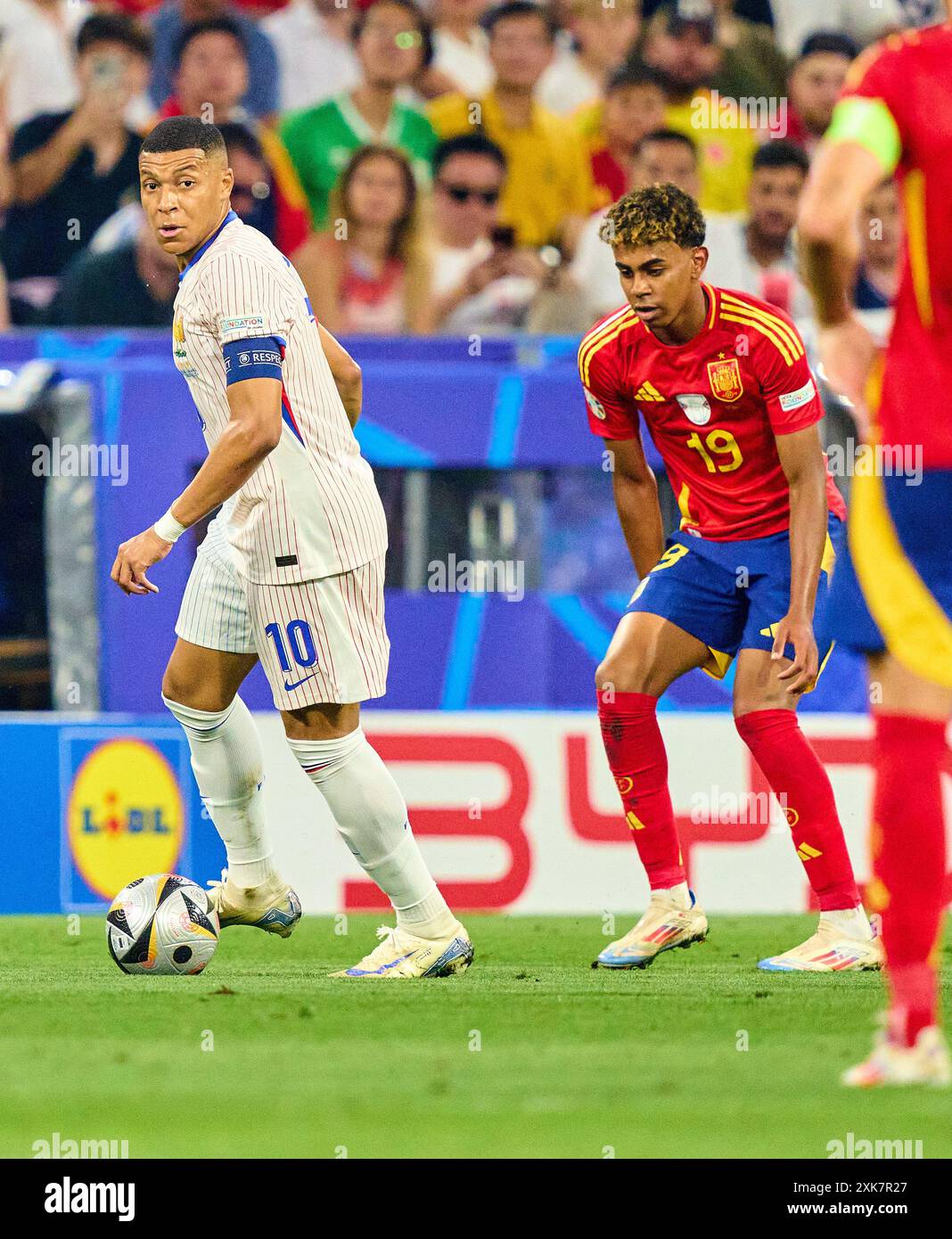 Kylian MBAPPE, FRA 10  compete for the ball, tackling, duel, header, zweikampf, action, fight against Lamine Yamal, ESP 19  in the semi final match  SPAIN - FRANCE 2-1 of the UEFA European Championships 2024  on Jul 9, 2024  in Munich, Germany.  Photographer: Peter Schatz Stock Photo