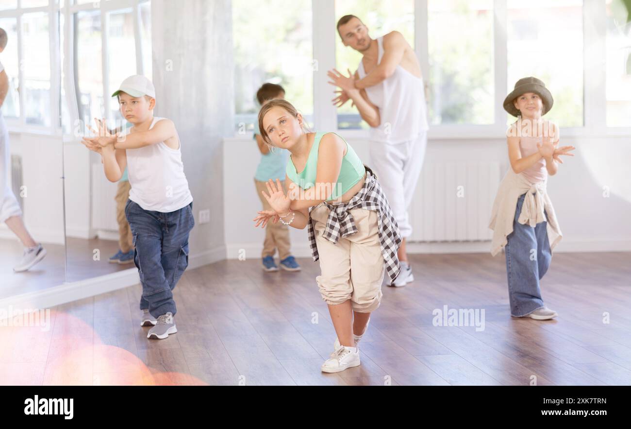 Girls and boys training hip hop in dance studio, dance classes for kids ...