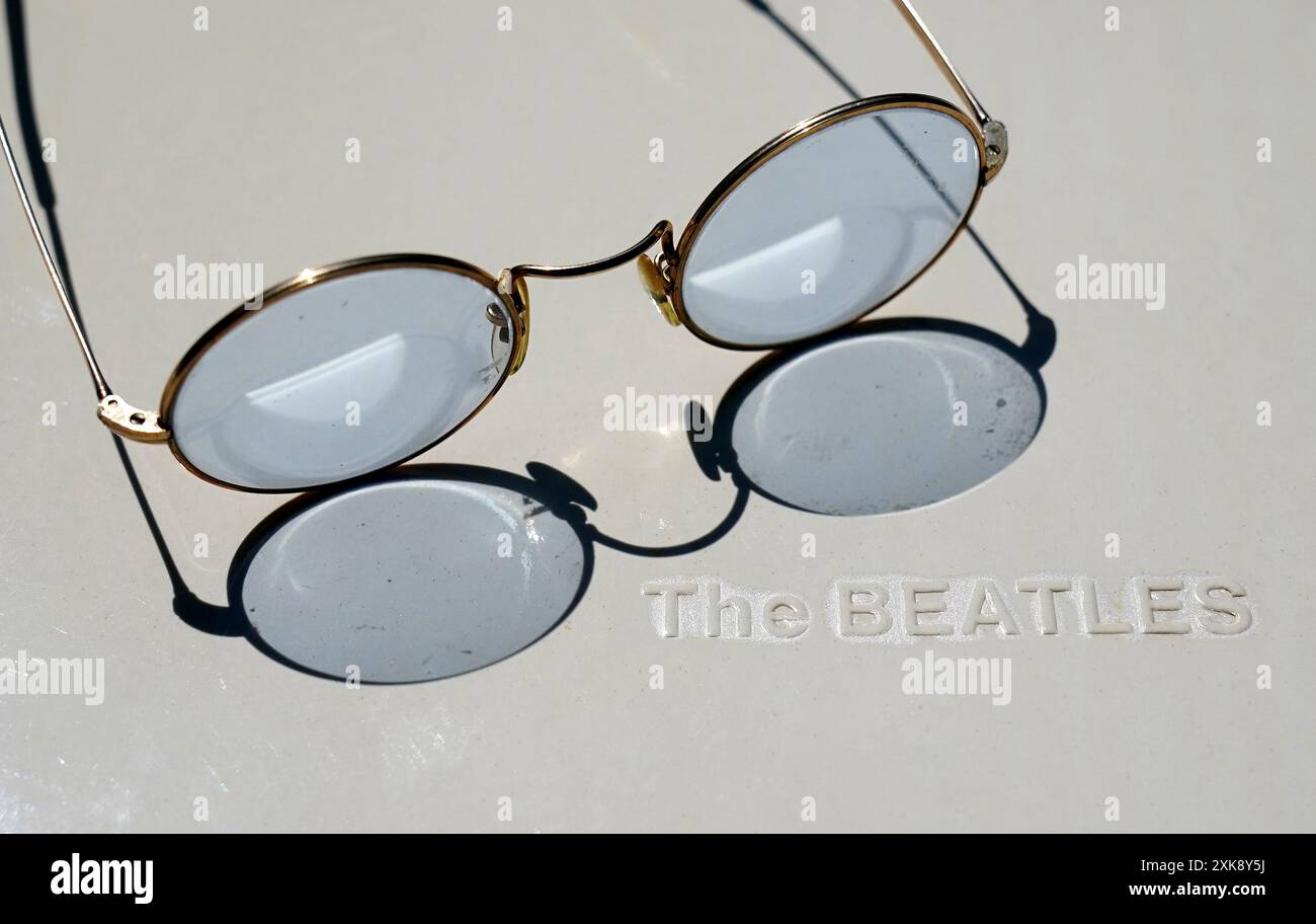 A View Of A Pair Of Round Blue Tinted John Lennon Style Glasses Which a-view-of-a-pair-of-round-blue-tinted-john-lennon-style-glasses-which