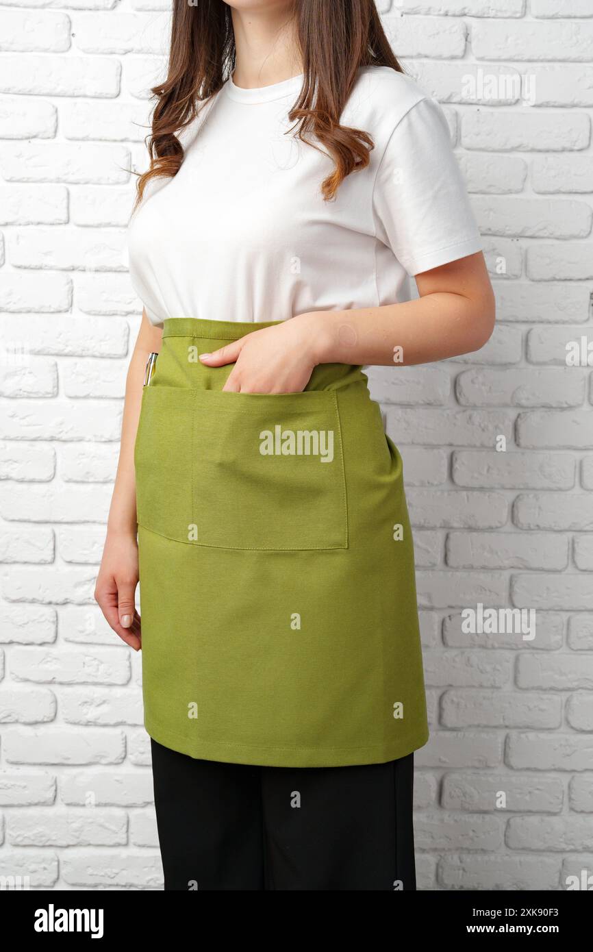 Barista wearing green apron hi-res stock photography and images - Alamy