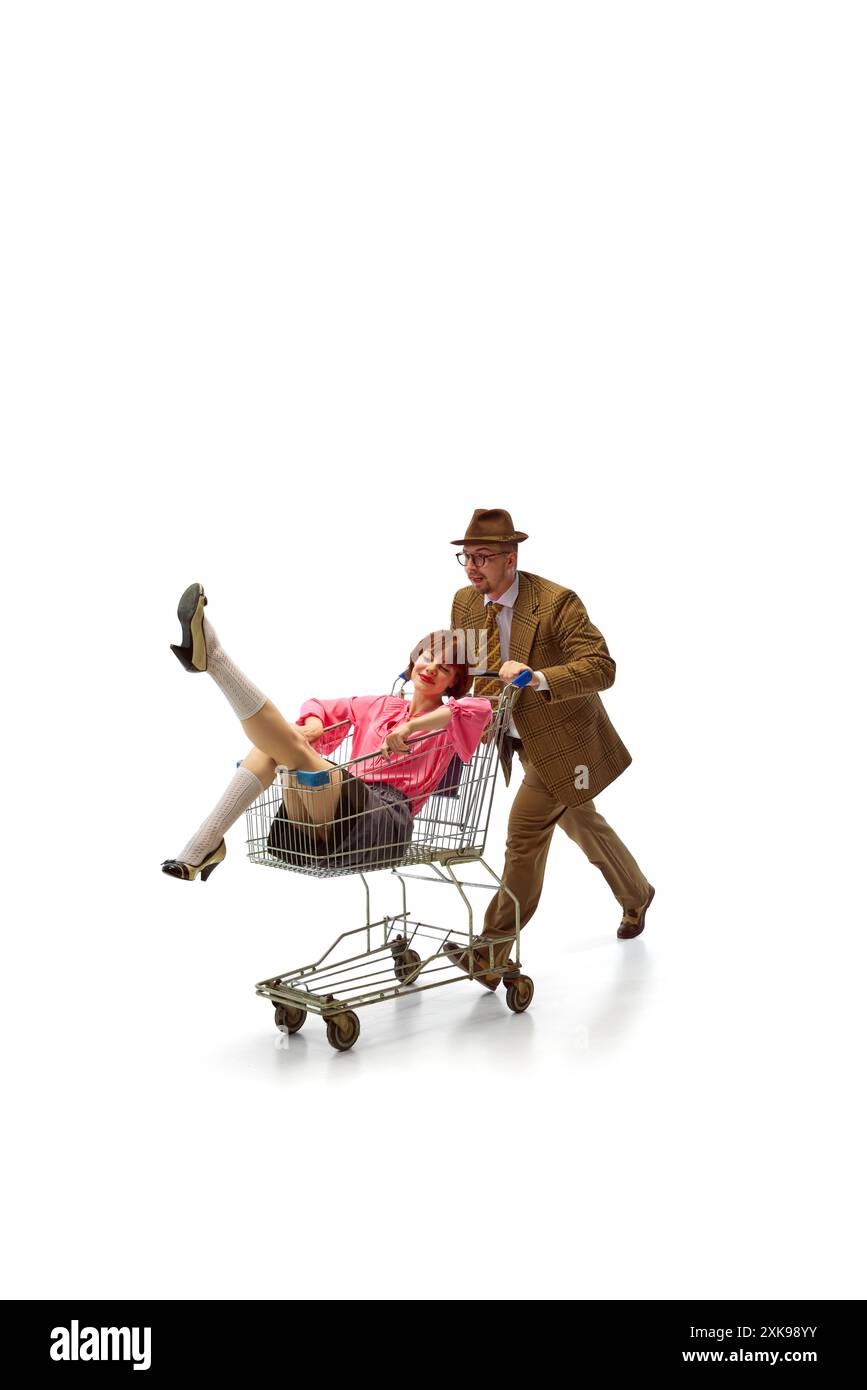 Formal Cart Man dressed formal attire and hat pushes shopping cart with pretty ...