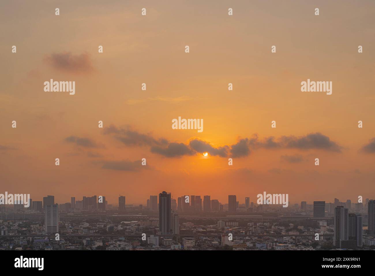 PM 2.5 dust in Bangkok,Capital city are covered by heavy smog,Sunset in downtown with bad air pollution, the Place to risk of cancer, environmental pr Stock Photo