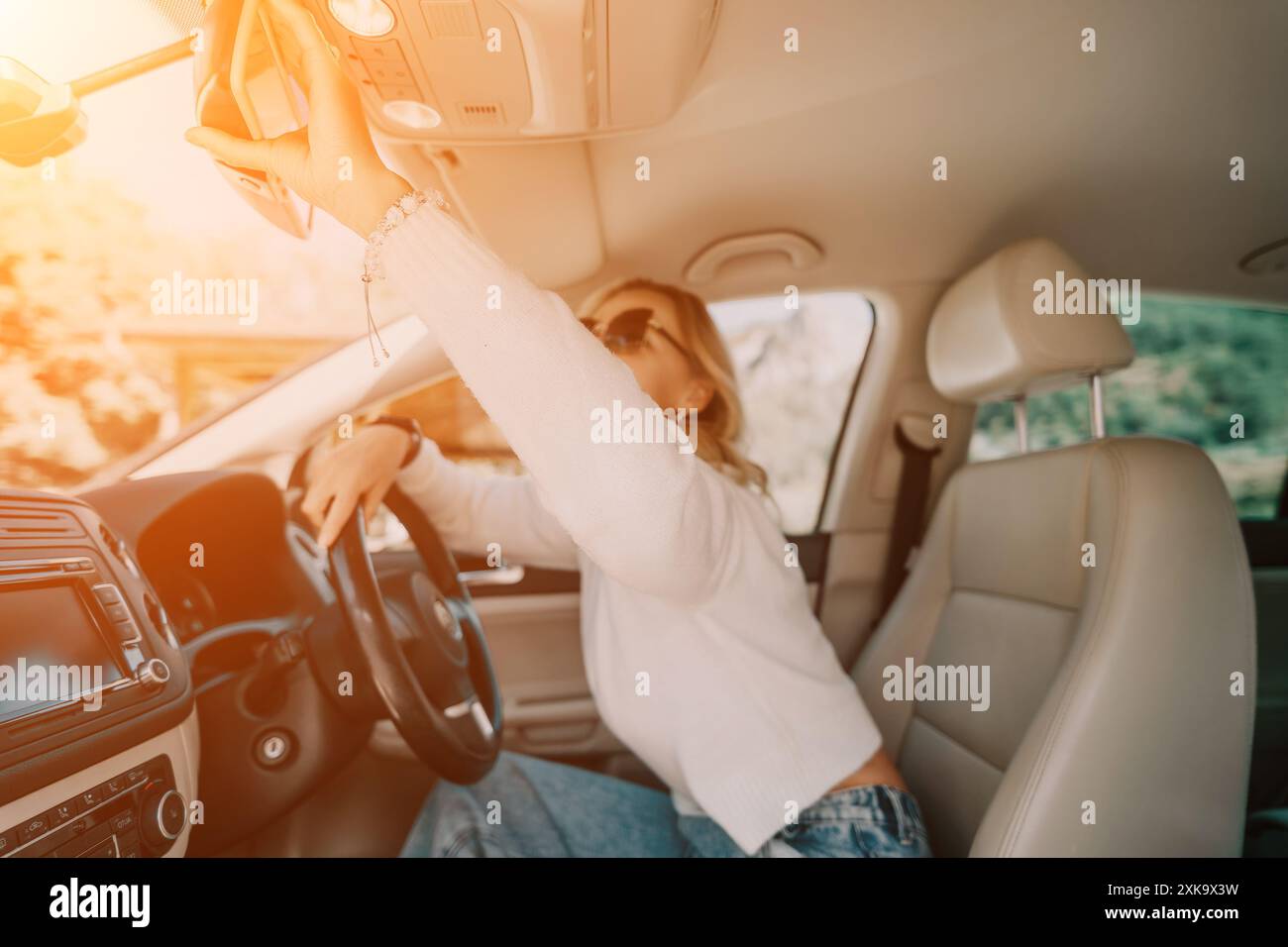 Woman adjusting car mirror hi-res stock photography and images - Alamy