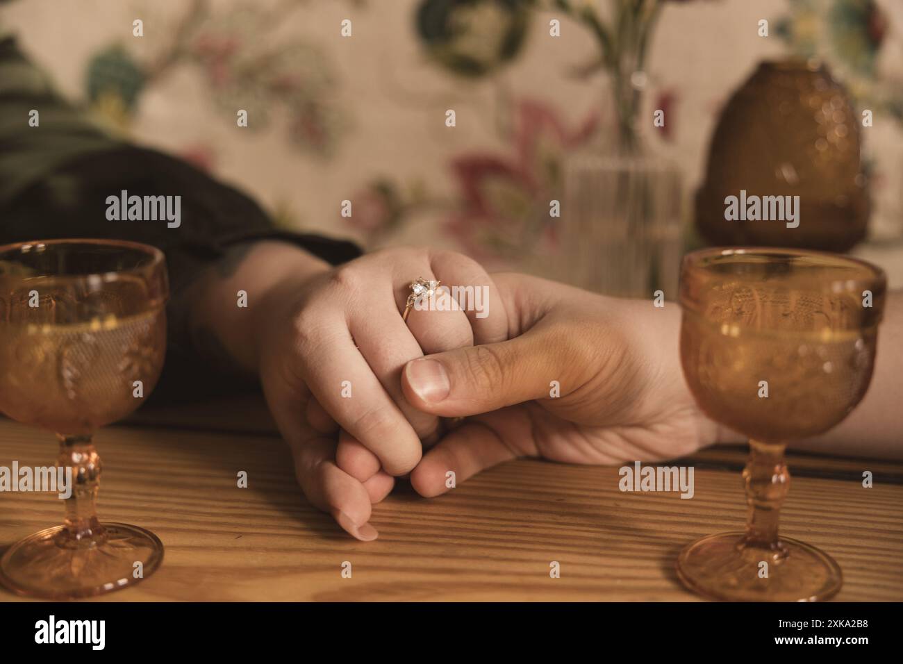 Couple holding hands with ring Stock Photo