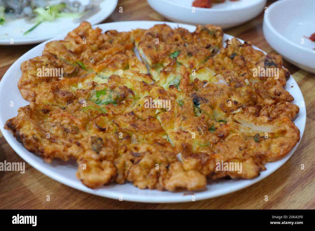 Haemulpajeon is a Korean whole dish with plenty of green onions and seafood Stock Photo