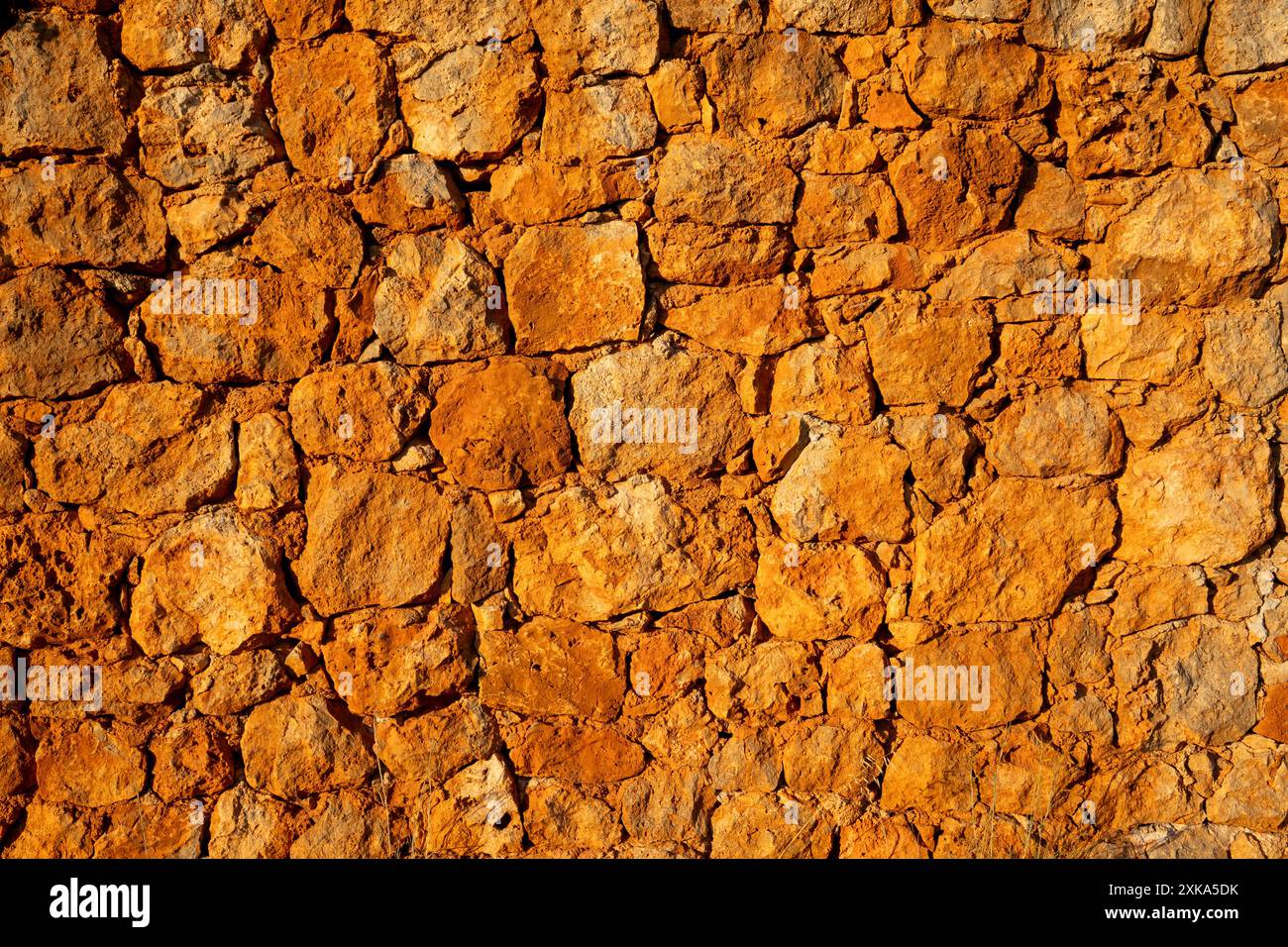 Natural rock wall, photographed at golden hour Stock Photo - Alamy