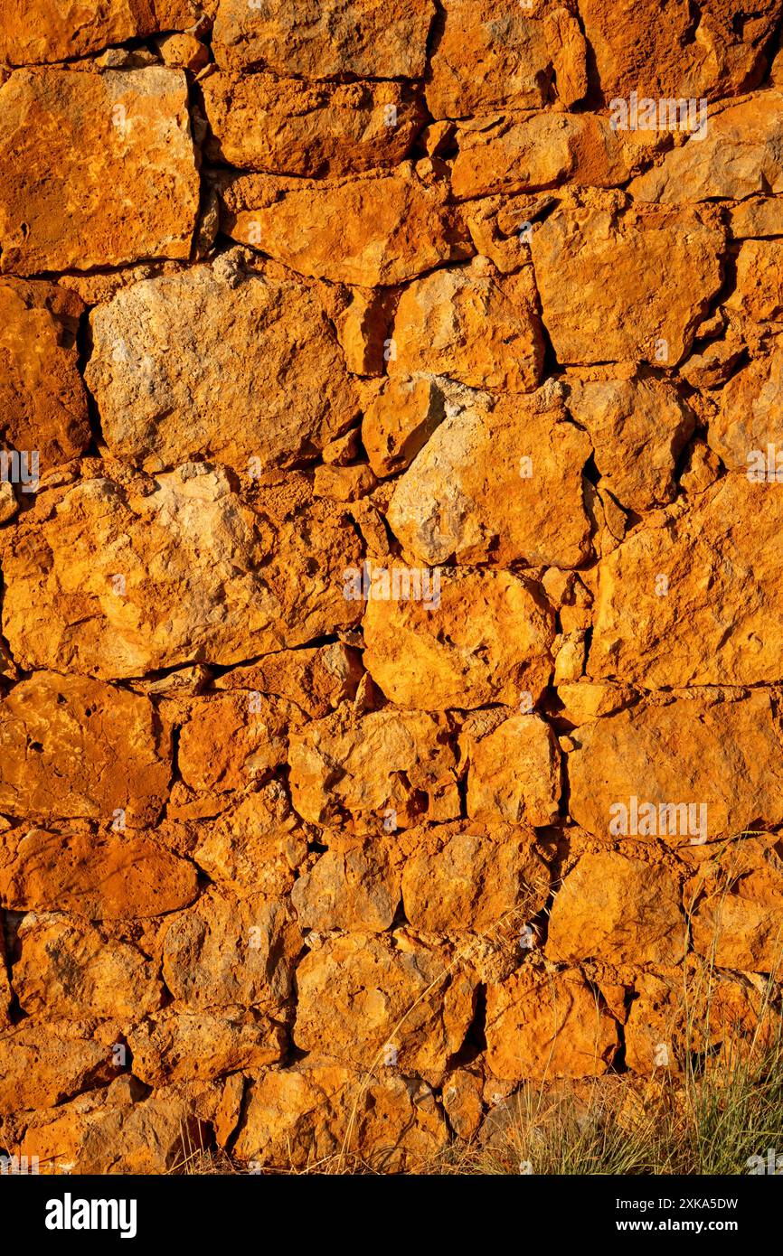 Natural rock wall, photographed at golden hour Stock Photo - Alamy