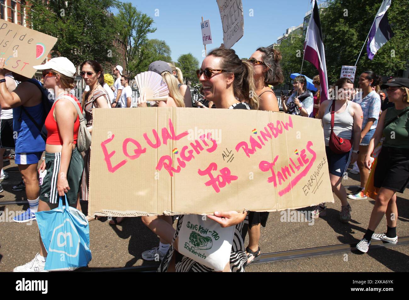 LGBTQ+ activists and supporters take part during Pride Walk protest on July 20, 2024 in Amsterdam,Netherlands. The LGBTQ+ community and supporters pro Stock Photo