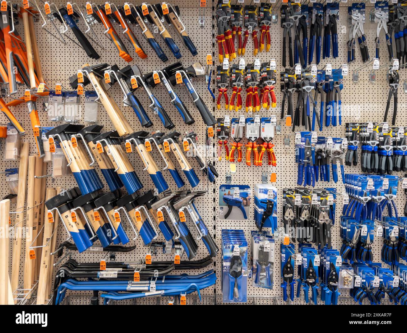 Work Hummers Italy - July 20, 2024: Work hammers and pliers and tongs displayed on ...