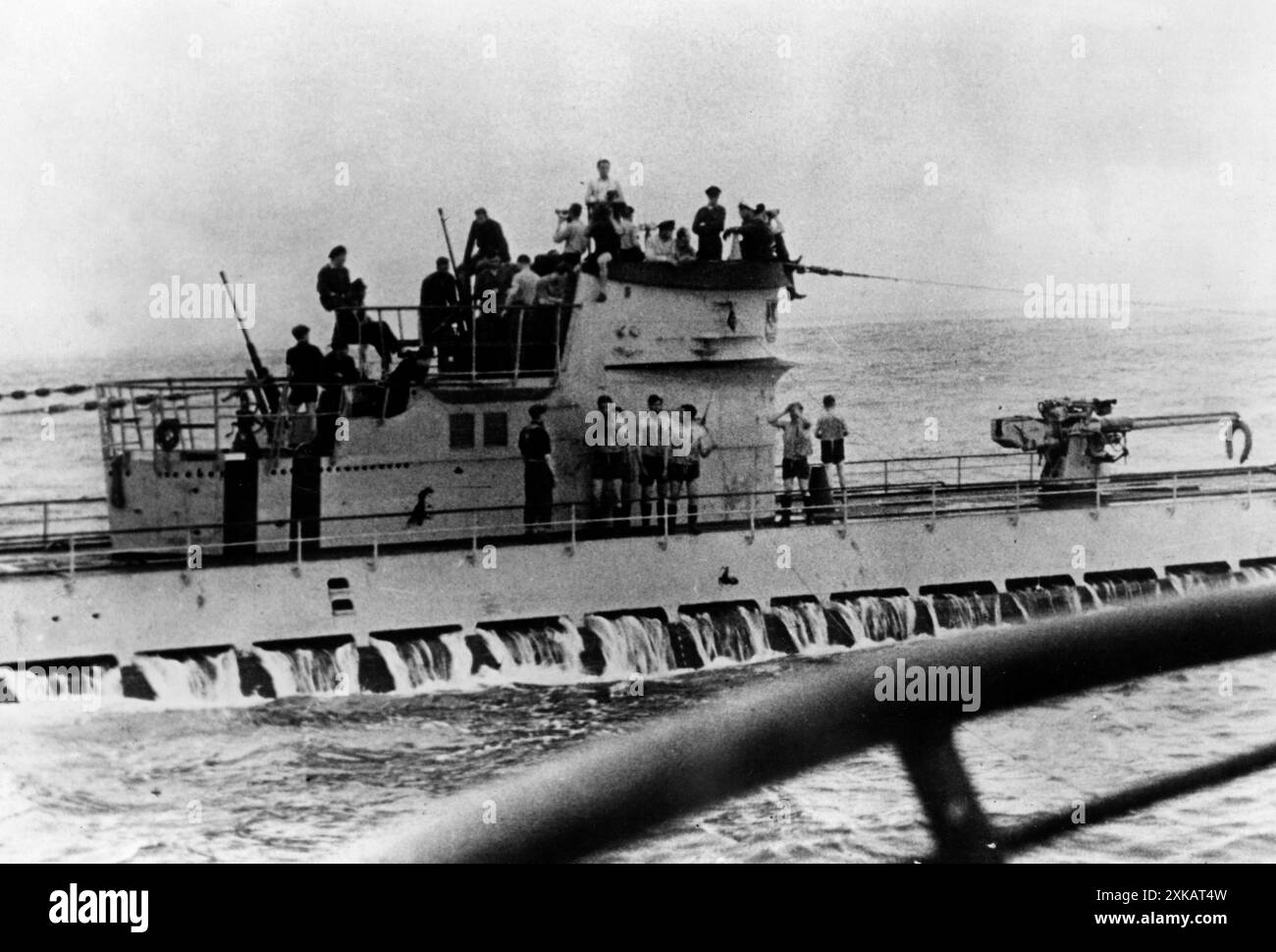 Two German submarines at a meeting in the Atlantic: a Type IX submarine ...