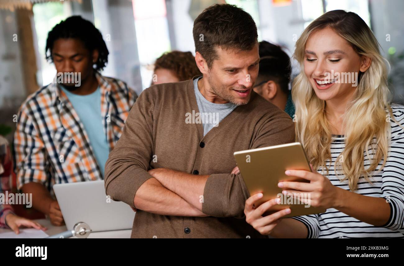 Programmers cooperating at IT company developing apps. People business work office concept Stock Photo