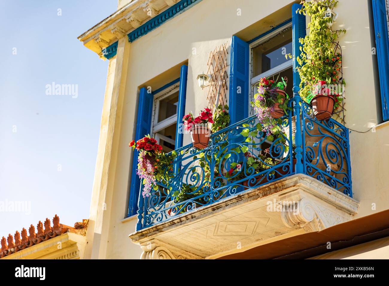 Tipical greek house, blu balcony with flowers, Athens, Greece - June 2024 © Giorgia De Dato Stock Photo