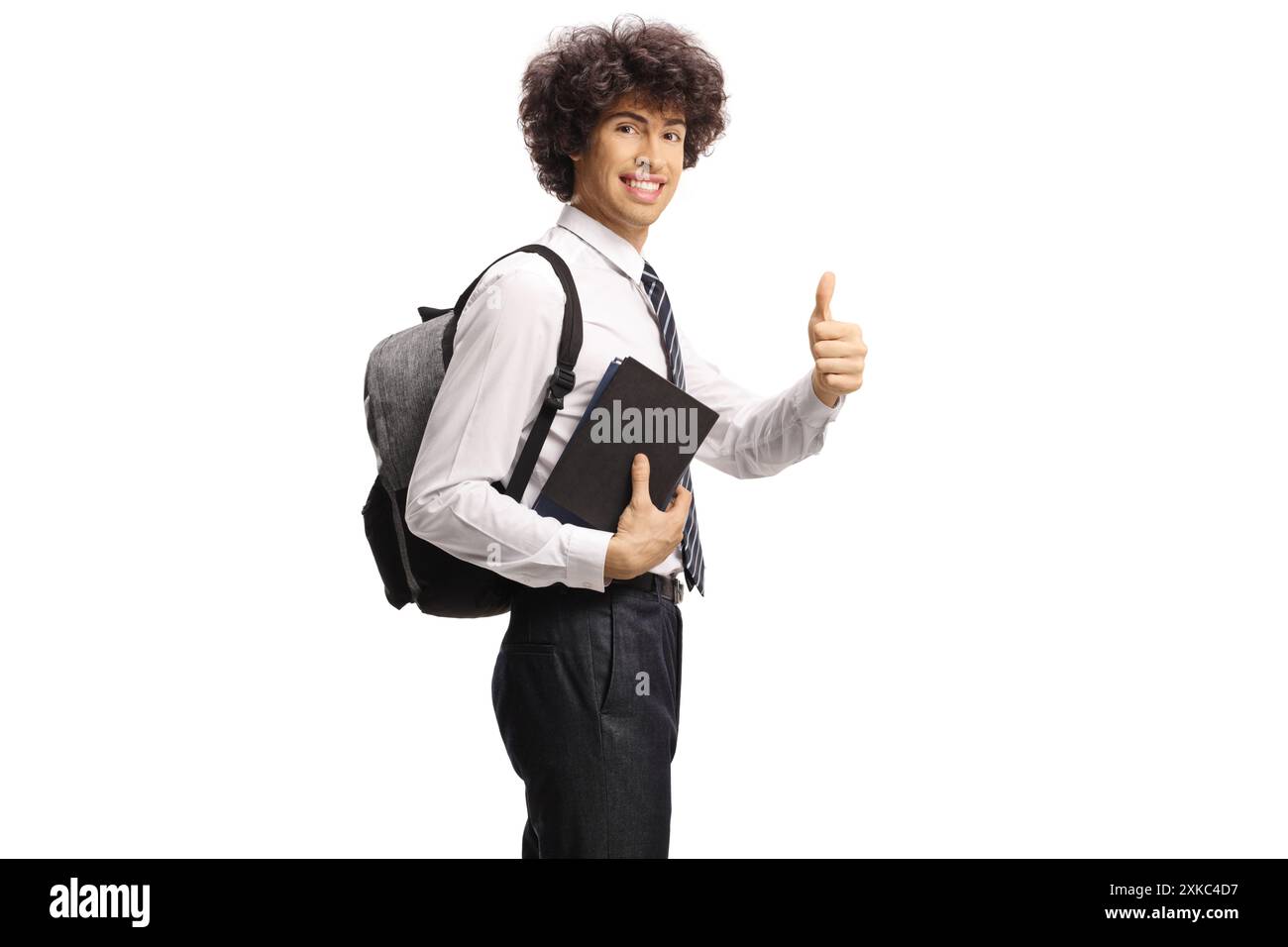 Male college student holding books and gesturing thumbs up isolated on ...