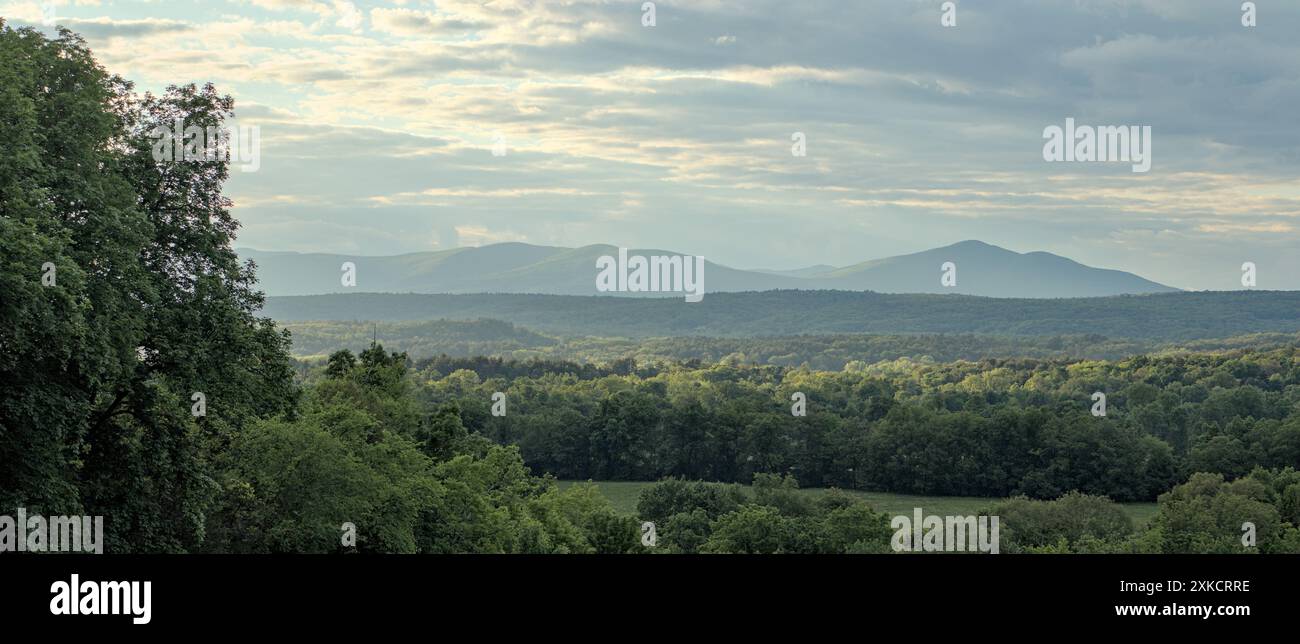 beautiful sunset in the mountains (slide mountain hudson valley catskills) catskill range with forest trees in the foreground landscape travel hiking Stock Photo