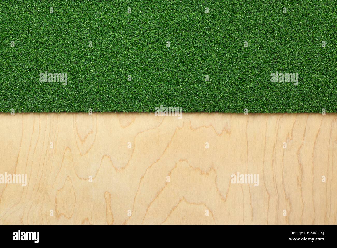 Green artificial grass rug on a wooden background. Artificial grass ...