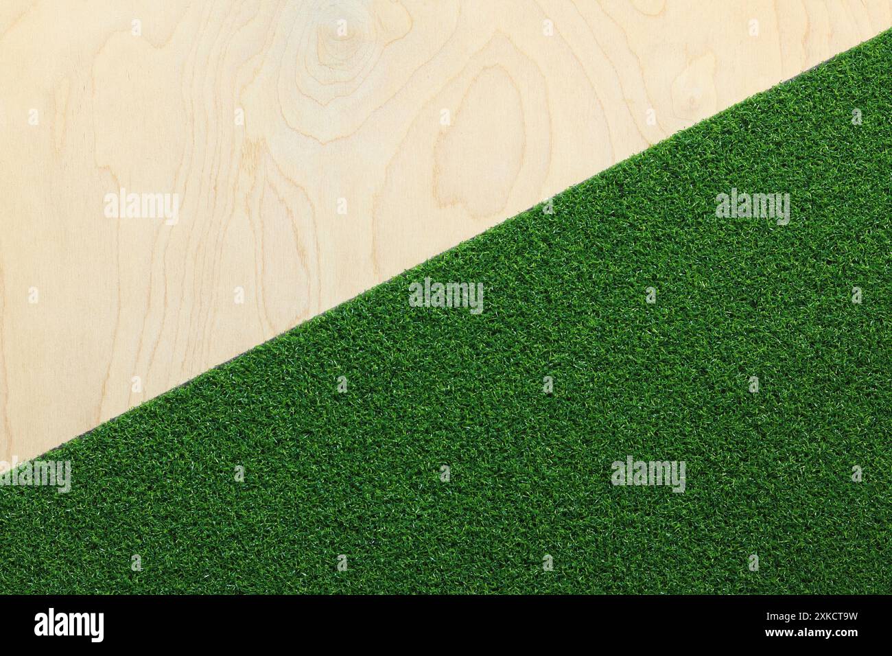 Green artificial grass rug on a wooden background. Artificial grass ...