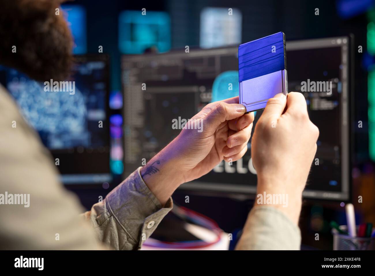 Scientist programming humanoid robot in hi-res stock photography and ...