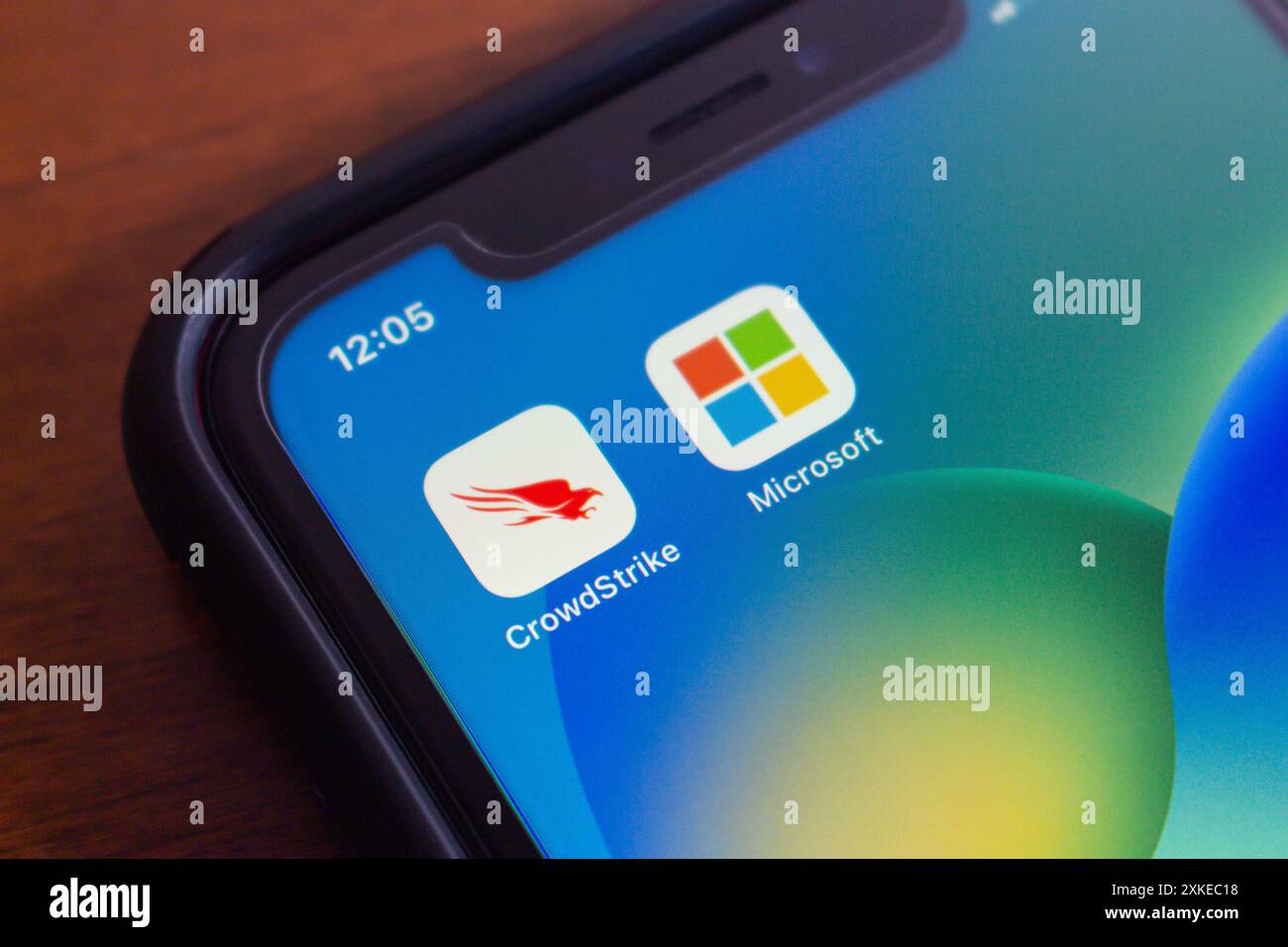 Vancouver, CANADA - Jul 22 2024 : CrowdStrike and Microsoft icons seen in an iPhone. On July 19, 2024, a CrowdStrike Windows sensor update caused glob Stock Photo