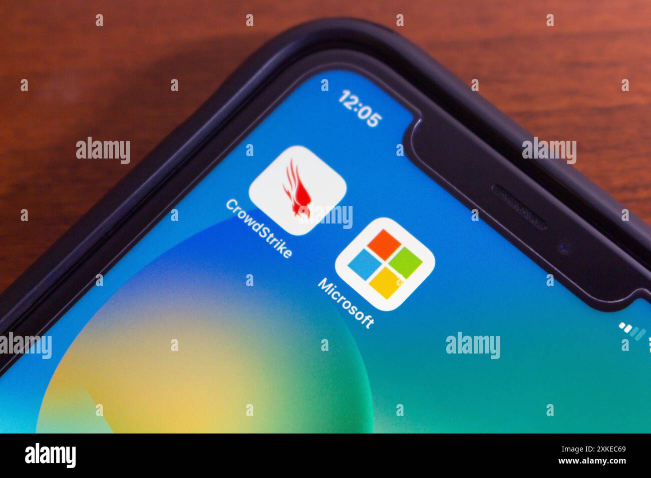 Vancouver, CANADA - Jul 22 2024 : CrowdStrike and Microsoft icons seen in an iPhone. On July 19, 2024, a CrowdStrike Windows sensor update caused glob Stock Photo