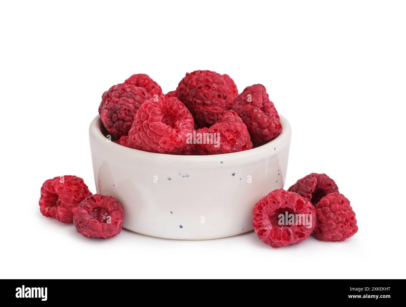 Bowl with tasty freeze-dried raspberry on white background Stock Photo ...
