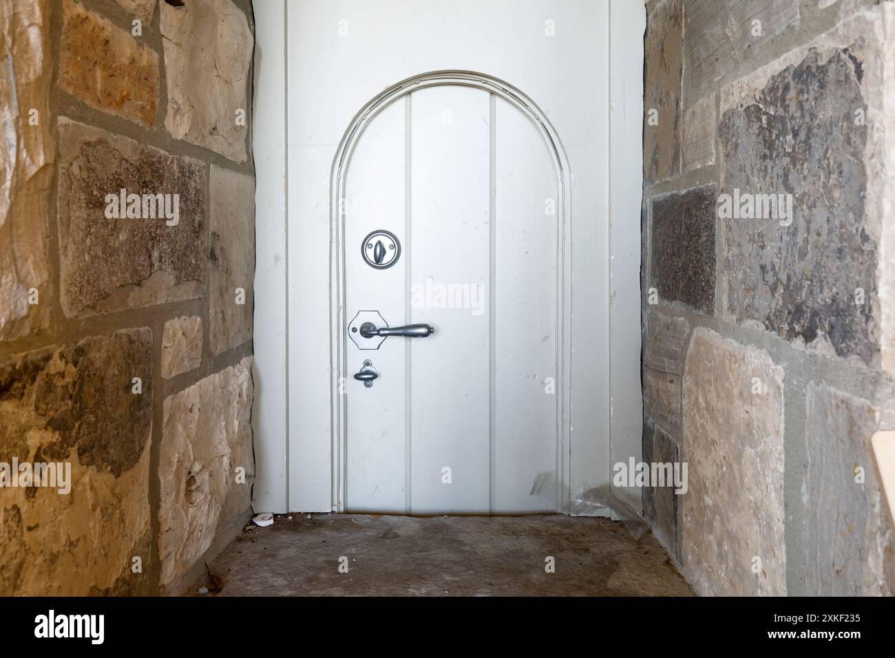 A very small wooden door. This house has since been demolished. Stock Photo